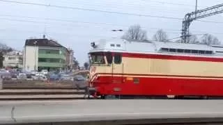Finnish diesel locomotive Dr13 departs with old wooden coaches