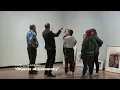 Hanging the exhibition Objects of Ceremony