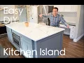 Easy DIY Kitchen Island with seating storage microwave under cabinet marble quartz countertop