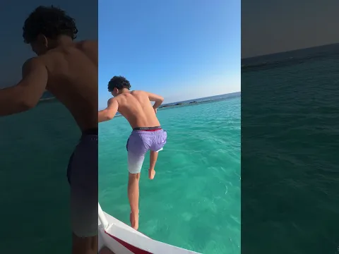 A guy was jumping and he slide and drop down in the yacht