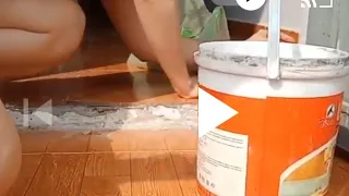beautiful single mom fixing her broken tile floor