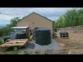 Norwesco 2500 gallon water storage tank install for rain water cistern at camp offgrid