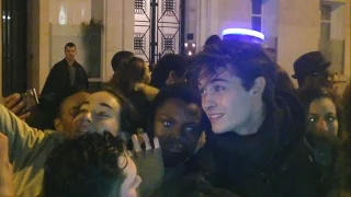 francisco lachowski surrounded by fans at balmain fashion show