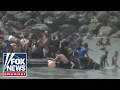BREAKING Migrants storm city border as national emergency requested