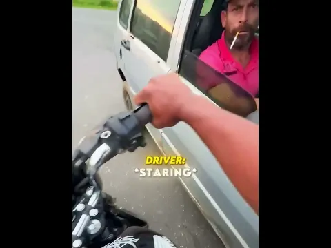Biker Bumps Into Car