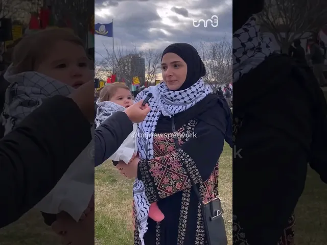 ⁣A mother holding her baby at a rally for P@lestine held in Detroit speaks to TMJ News