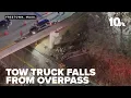 1 dead after tow truck plummets from overpass on Route 140 south