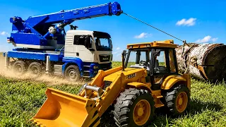 Story with Giant Bruder Crane & JCB Backhoe Loader at Construction Site