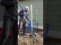 NW Quik Pull pulling a metal fence post with concrete footing
