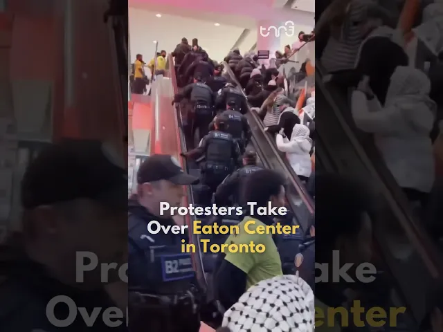 ⁣Police expell pro-Palestinian protesters out of the Eaton Center in Toronto, Canada.