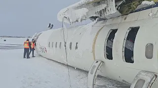 Investigators Examining Fuselage A25O0021 