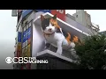 Download Lagu 3D digital billboard image of a giant cat draws attention in Tokyo