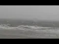 Wind surfing Dutch style: crazy surfer in storm at the North Sea