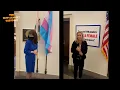 Rep Greene hangs sign in answer to transgender flag set by a Democrat