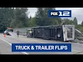 Truck pulling travel trailer rolls on Highway 26 overpass near Oregon Zoo