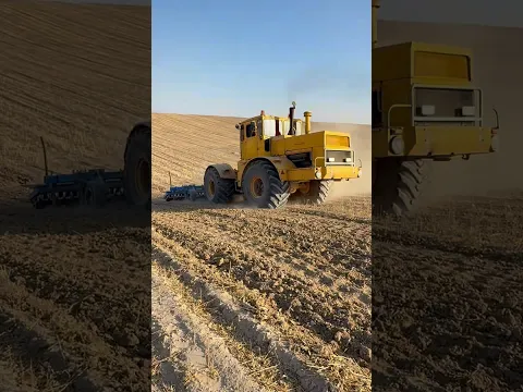 THE YELLOW TRACTOR STRUGGLES TO PLOW THE FIELD