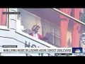 Man living inside billboard above Sunset Boulevard draws a crowd