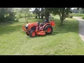 Cutting grass with a B2650 Tractor 72 inch belly deck