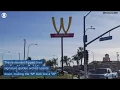 McDonalds sign flips golden arches upside down to create a W for women