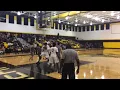 Derrick Harrell follows his own miss for a three-point play