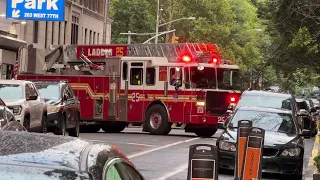 FDNY LADDER 25 RESPONDING FROM QUARTERS ON WEST 77TH STREET ON WEST SIDE OF MANHATTAN NEW YORK CITY