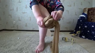 legs of a mature lady in nylon pantyhose