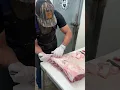 Prepping a beef strip loin for steaks