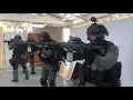 Police s Counter Assault Unit Operators demonstrating clearing a safe path for their VIP charges