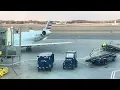 As American Airlines 1857 heads for take off and a private jet lands taxis filmed February 29 2024