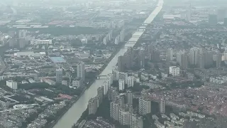 On approach, landing and taxing to the gate at PVG international airport in Shanghai China