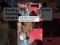 People gather around Waymos after power outage