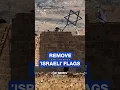 Activists remove Israeli flags star from settler-occupied building