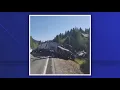 Semi-truck rolls hangs over embankment after crash on Highway 55 near Smiths Ferry