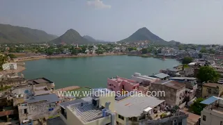 Pushkar city and Pushkar Lake surrounded by the Aravalli hills