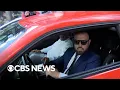 Watch Lawyer hits car while trying to escape reporters outside courthouse