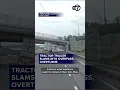 Tractor-trailer slams into overpass overturns