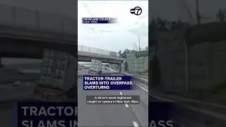 Tractor-trailer slams into overpass overturns
