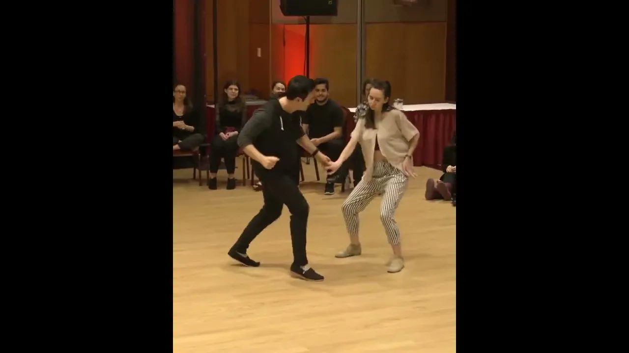 Jordan dances with a West Coast Swing Newcomer at Budafest