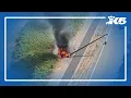 Car catches fire after crashing in Redmond