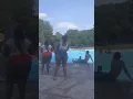 Guy sings happy birt ay and jumps in the pool with guitar at marsh creek