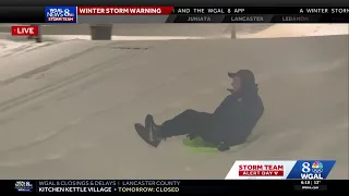 WGAL News 8 s Tom Lehman sleds down the PA Capitol steps in Harrisburg