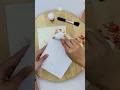 Gold leaf edges on wedding invitation