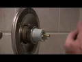 How to adjust the hot water output on a Delta shower faucet