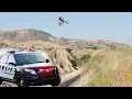 Motorcycle Escapes Police by Jumping over Train Tracks