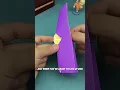 Without tearing the paper how can you pass a coin through it
