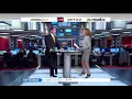 Chris Jansing standing in short skirt suit t-strap high heels