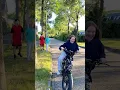 Avelina rides on Akim’s new bike