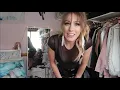 Women try on latex or PVC skirts and dresses