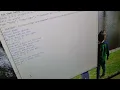 Madeleine coding a ghost game in Python
