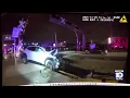 Newly released shows police response after woman pulled from car on train tracks